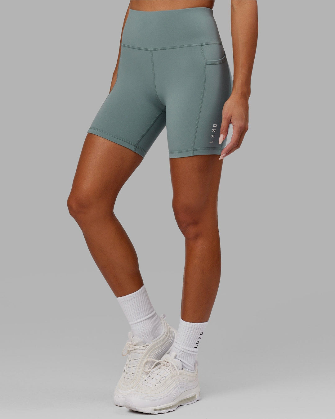 Woman wearing Rep Mid Short Tight Small Logo - Eclipse