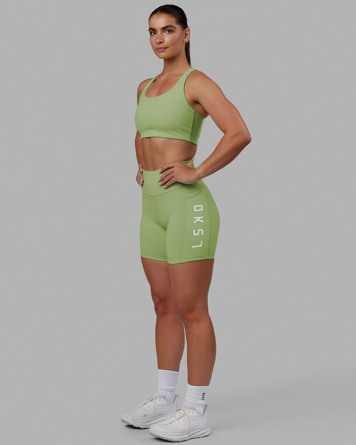 Woman wearing Rep Mid Short Tights - Green Fig