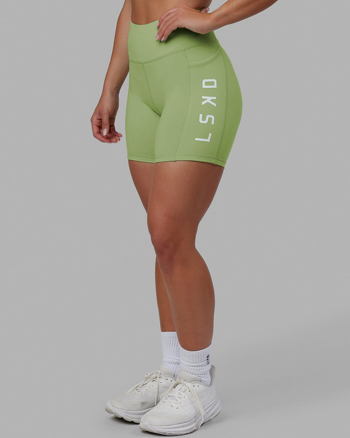 Woman wearing Rep Mid Short Tights - Green Fig