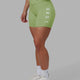 Woman wearing Rep Mid Short Tights - Green Fig