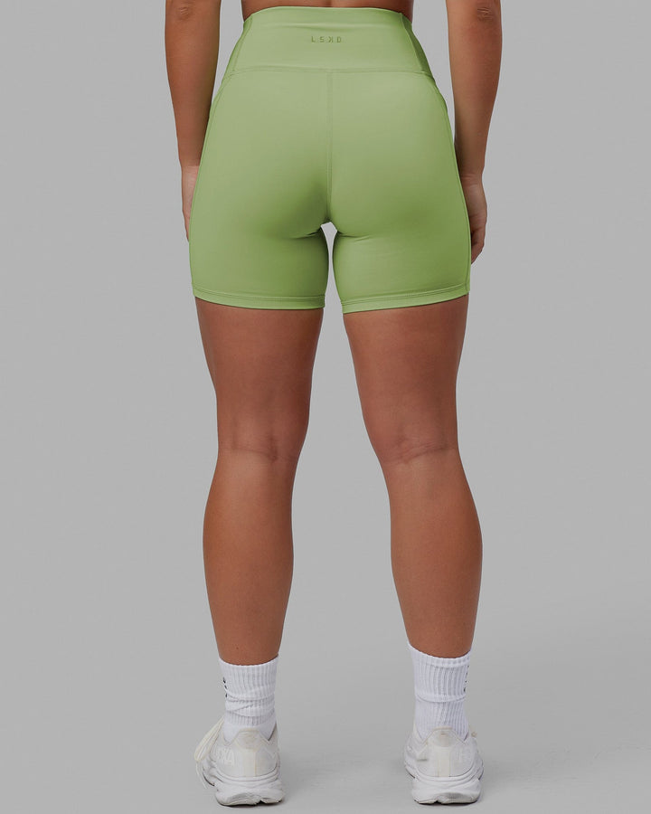 Woman wearing Rep Mid Short Tights - Green Fig