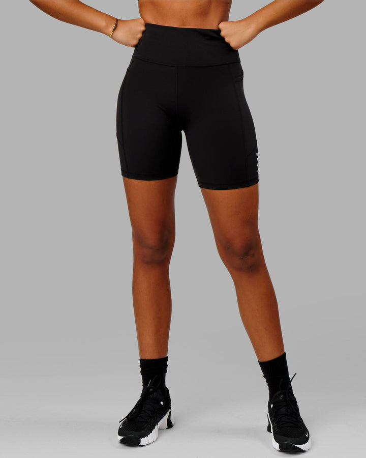 Woman wearing Rep Mid Short Tight Small Logo - Black