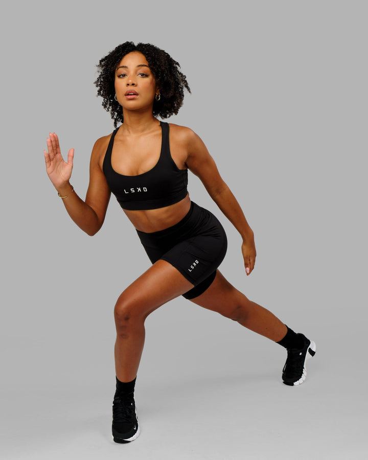 Woman wearing Rep Mid Short Tight Small Logo - Black