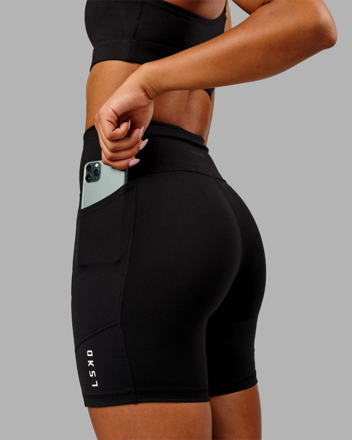 Woman wearing Rep Mid Short Tight Small Logo - Black