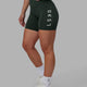 Woman wearing Rep Mid Short Tights - Vital Green