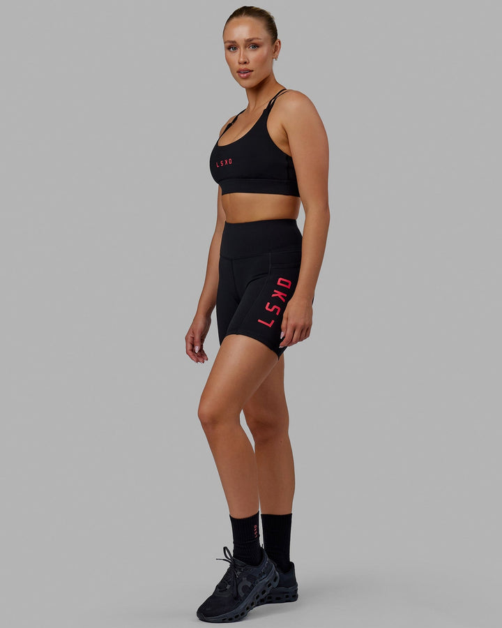 Woman wearing Rep Mid Short Tights - Black-Raspberry