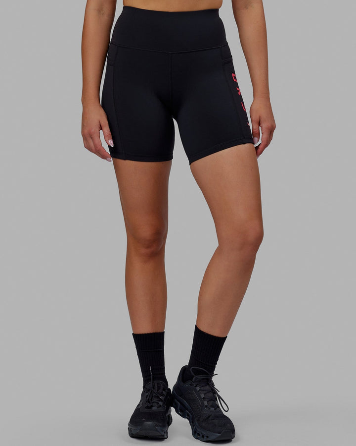 Woman wearing Rep Mid Short Tights - Black-Raspberry