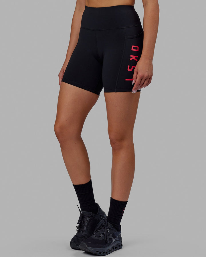 Woman wearing Rep Mid Short Tights - Black-Raspberry