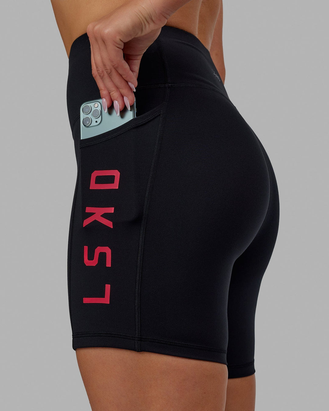 Woman wearing Rep Mid Short Tights - Black-Raspberry