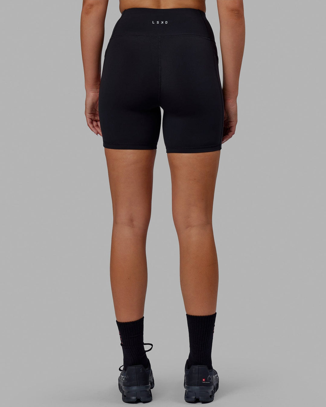 Woman wearing Rep Mid Short Tights - Black-Raspberry