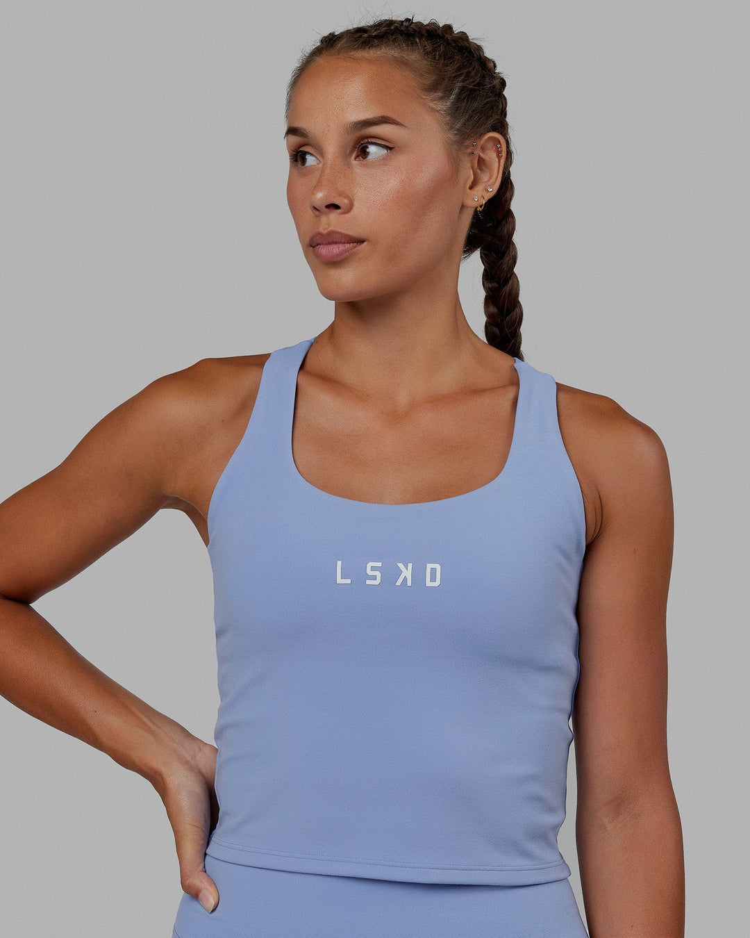 Woman wearing Rep Shelf Bra Performance Tank - Arctic Blue
