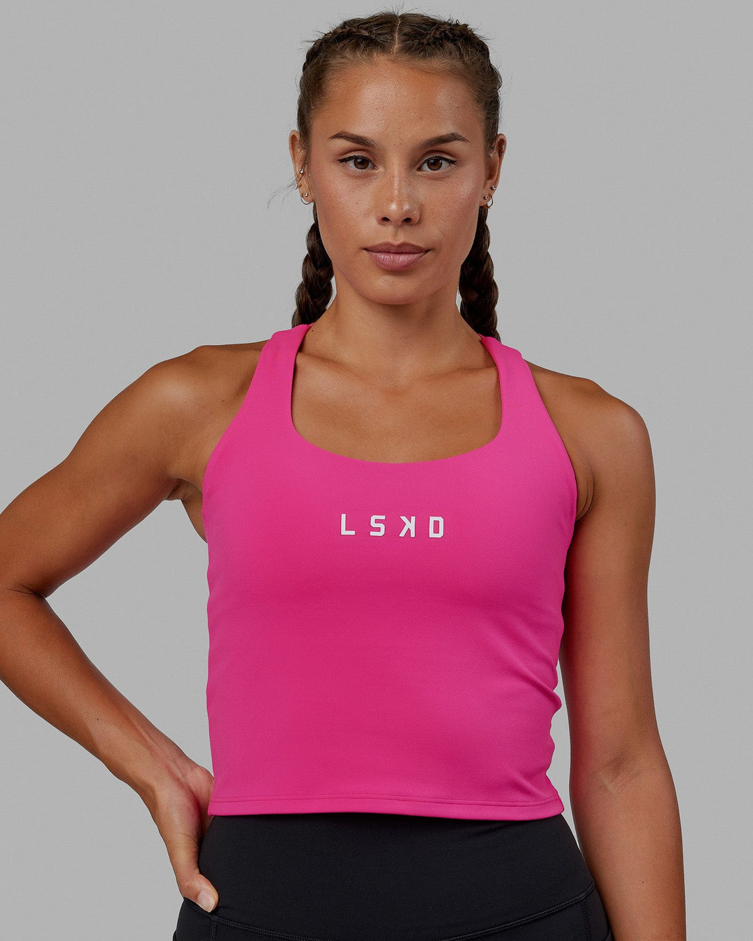 Woman wearing Rep Shelf Bra Performance Tank - Ultra Pink
