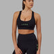 Woman wearing Rep Sports Bra Small Logo - Black-Apple Mint