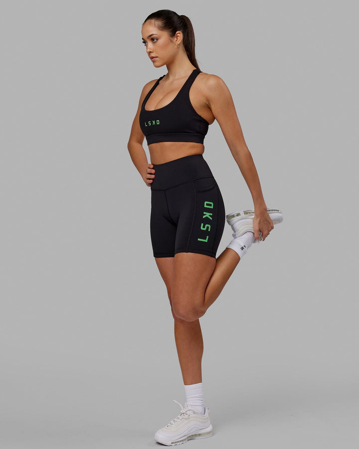 Woman wearing Rep Sports Bra Small Logo - Black-Apple Mint