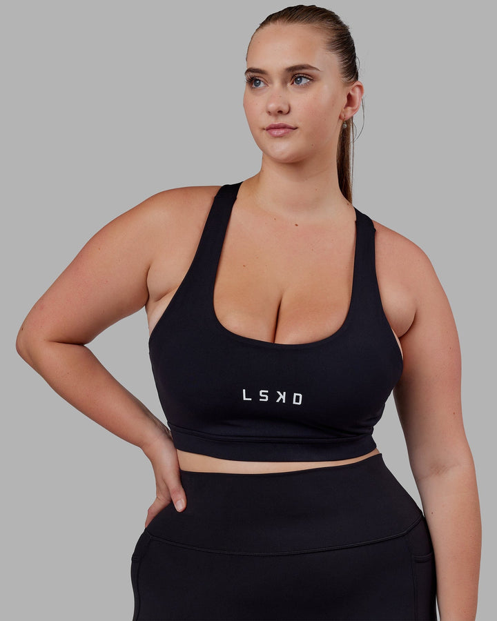 Woman wearing Rep Sports Bra Small Logo - Black-White