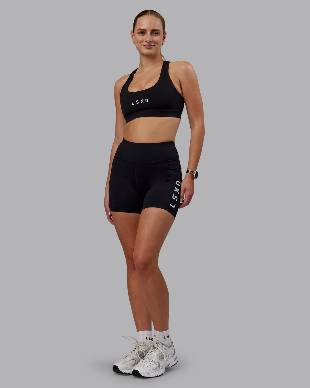 Woman wearing Rep Ultra High-Rise 4&quot; Short Pockets - Black-White | Model:Lillie | Size:S