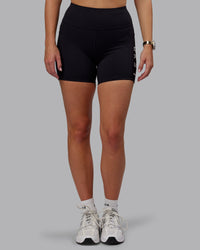 Woman wearing Rep Ultra High-Rise 4" Short Pockets - Black-White | Model:Lillie | Size:S