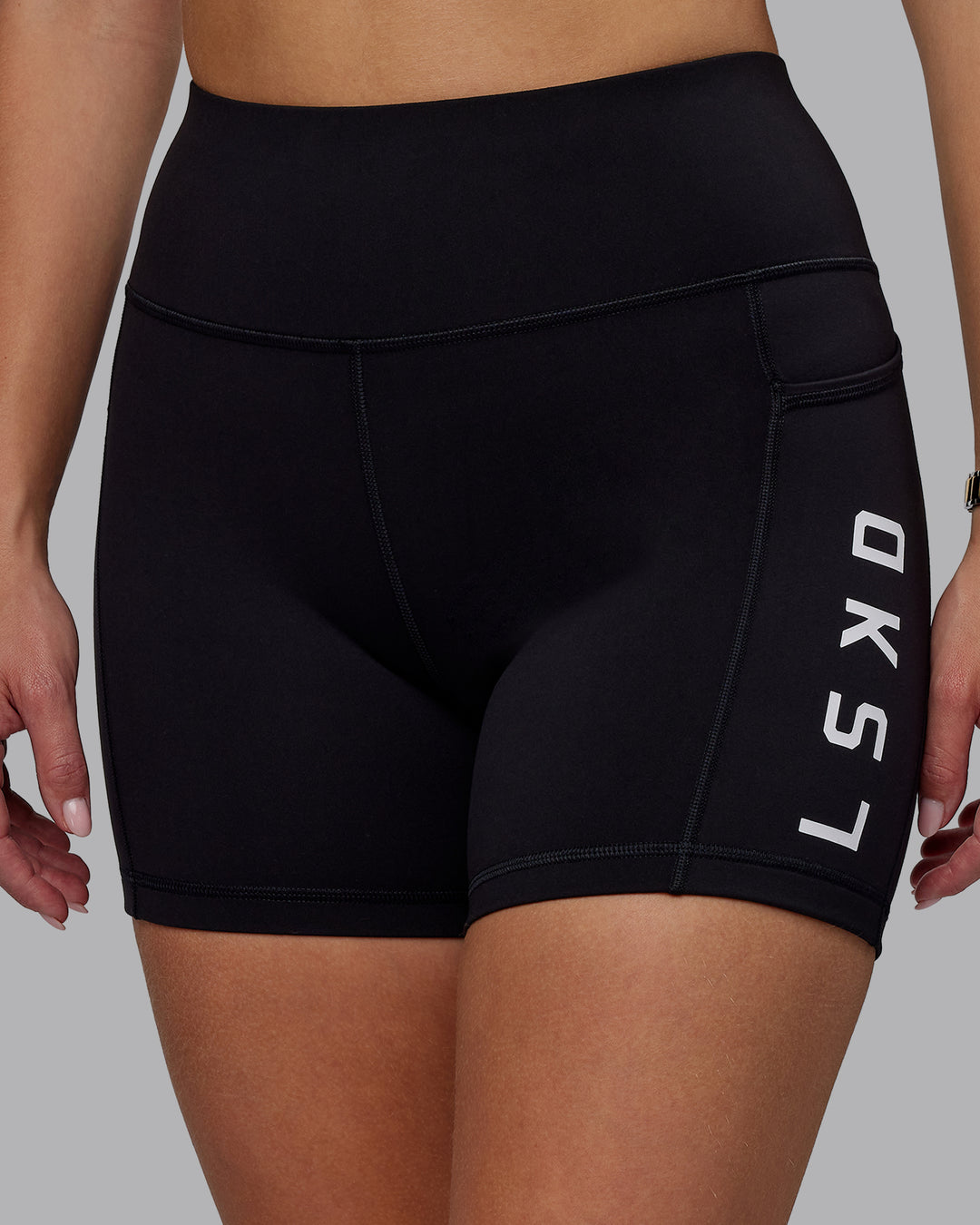 Woman wearing Rep Ultra High-Rise 4&quot; Short Pockets - Black-White | Model:Lillie | Size:S