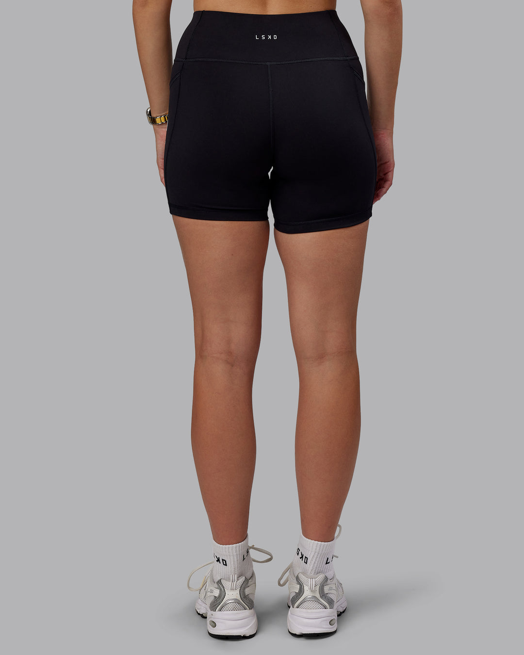 Woman wearing Rep Ultra High-Rise 4&quot; Short Pockets - Black-White | Model:Lillie | Size:S