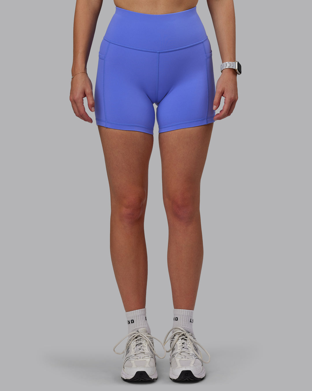 Woman wearing Rep Ultra High-Rise 4&quot; Short Pockets - Baja Blue-White | Model:Lillie | Size:S