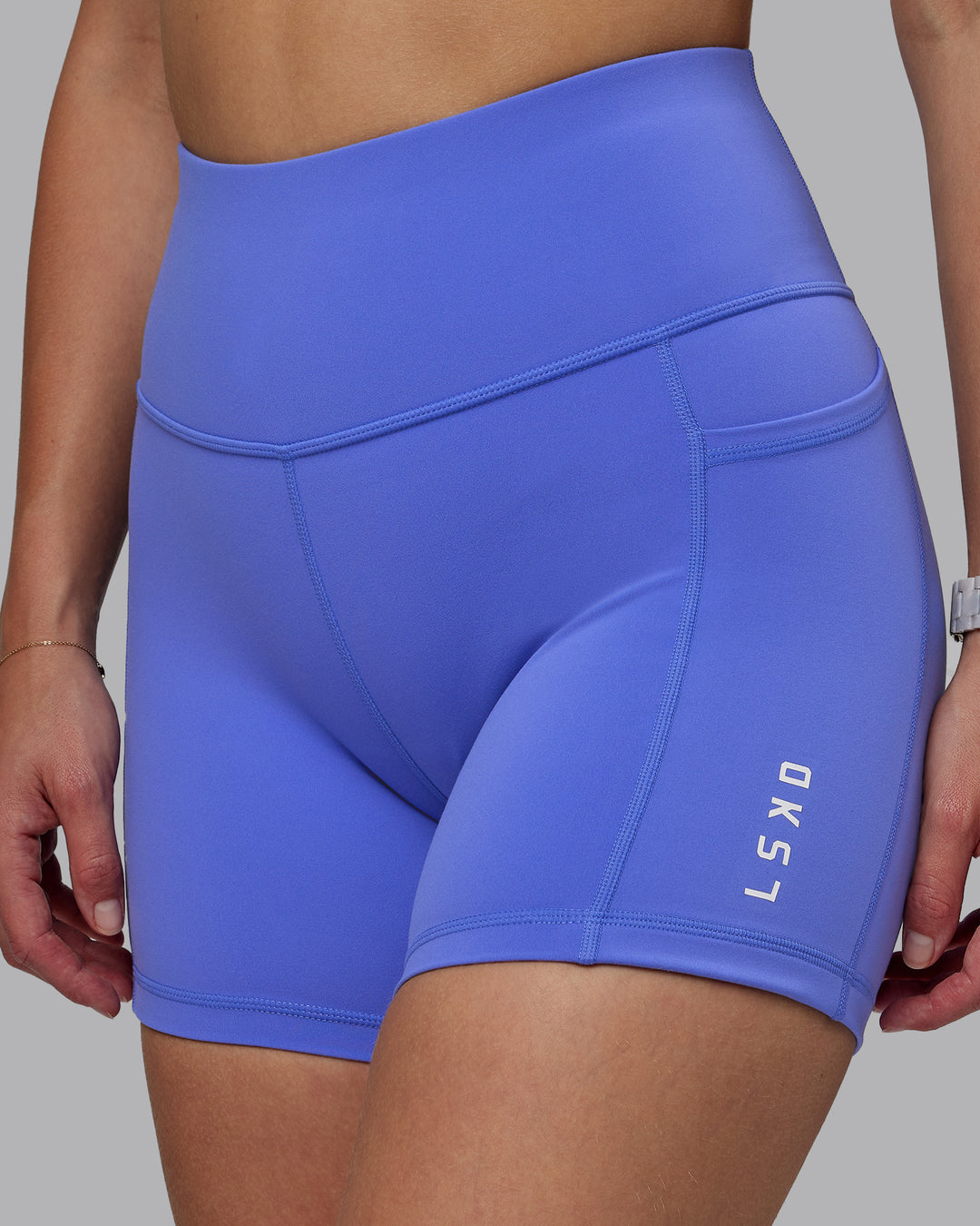 Woman wearing Rep Ultra High-Rise 4&quot; Short Pockets - Baja Blue-White | Model:Lillie | Size:S