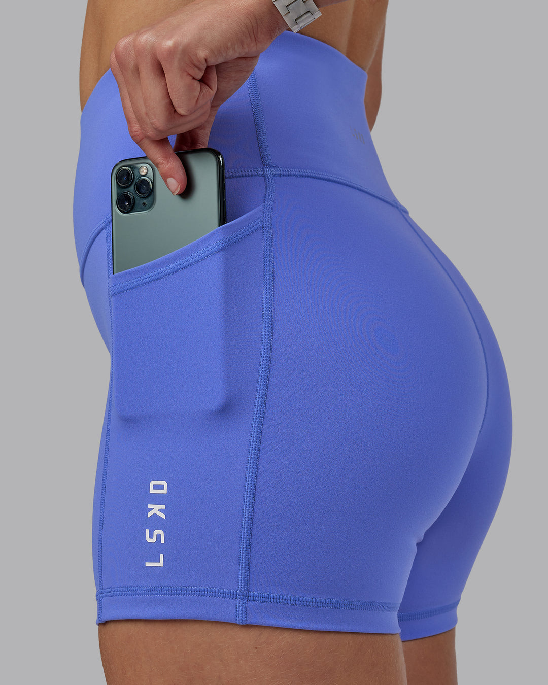 Woman wearing Rep Ultra High-Rise 4&quot; Short Pockets - Baja Blue-White | Model:Lillie | Size:S