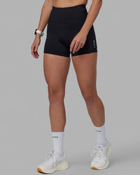 Women wearing O.G. Rep Ultra High-Rise 4" Short Pockets - Black-White | Model:Shae | Size:S