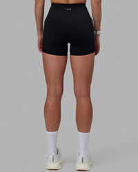 Women wearing O.G. Rep Ultra High-Rise 4" Short Pockets - Black-White | Model:Shae | Size:S