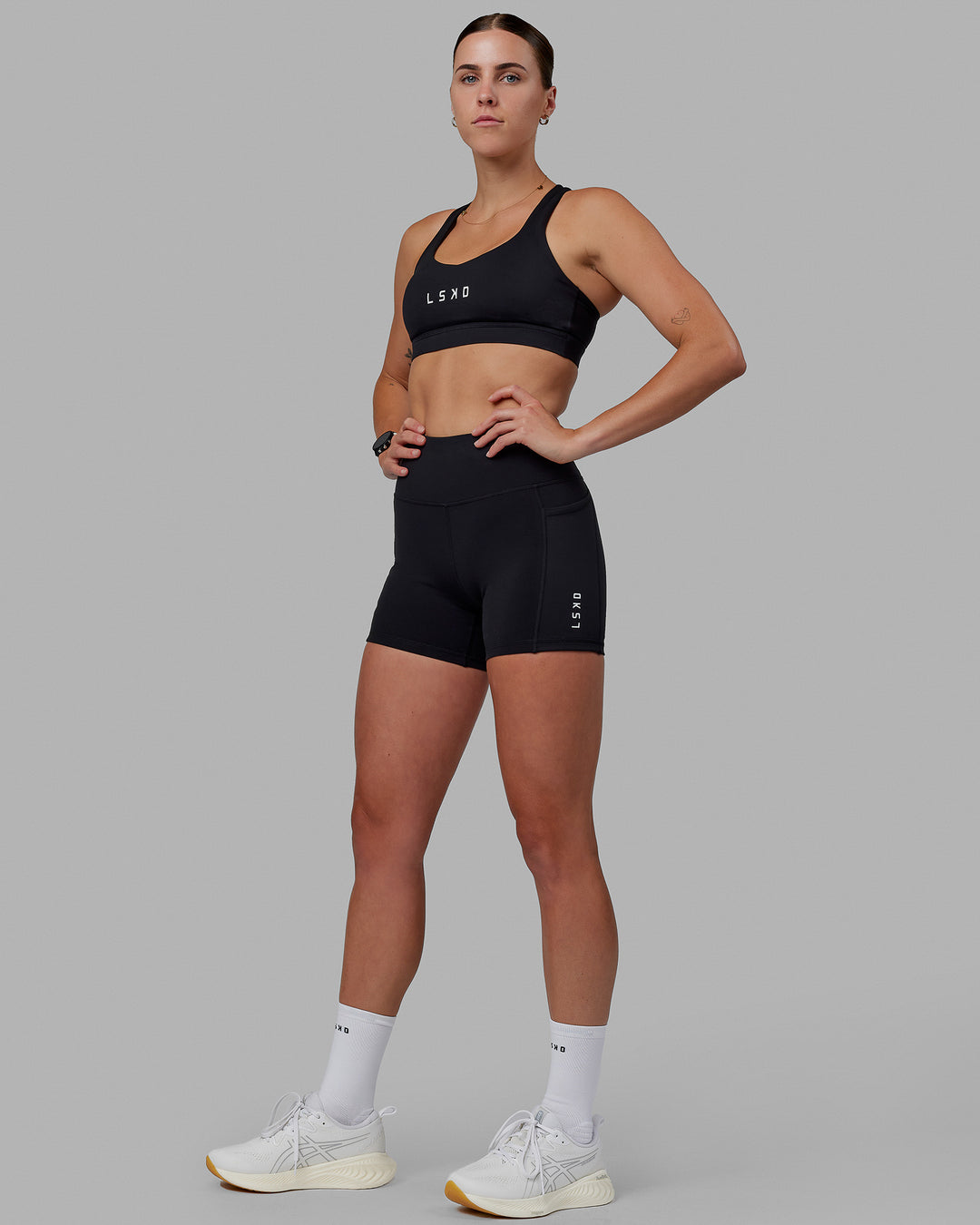 Women wearing O.G. Rep Ultra High-Rise 4&quot; Short Pockets - Black-White | Model:Shae | Size:S
