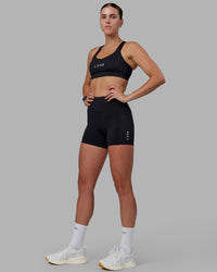 Women wearing O.G. Rep Ultra High-Rise 4" Short Pockets - Black-White | Model:Shae | Size:S
