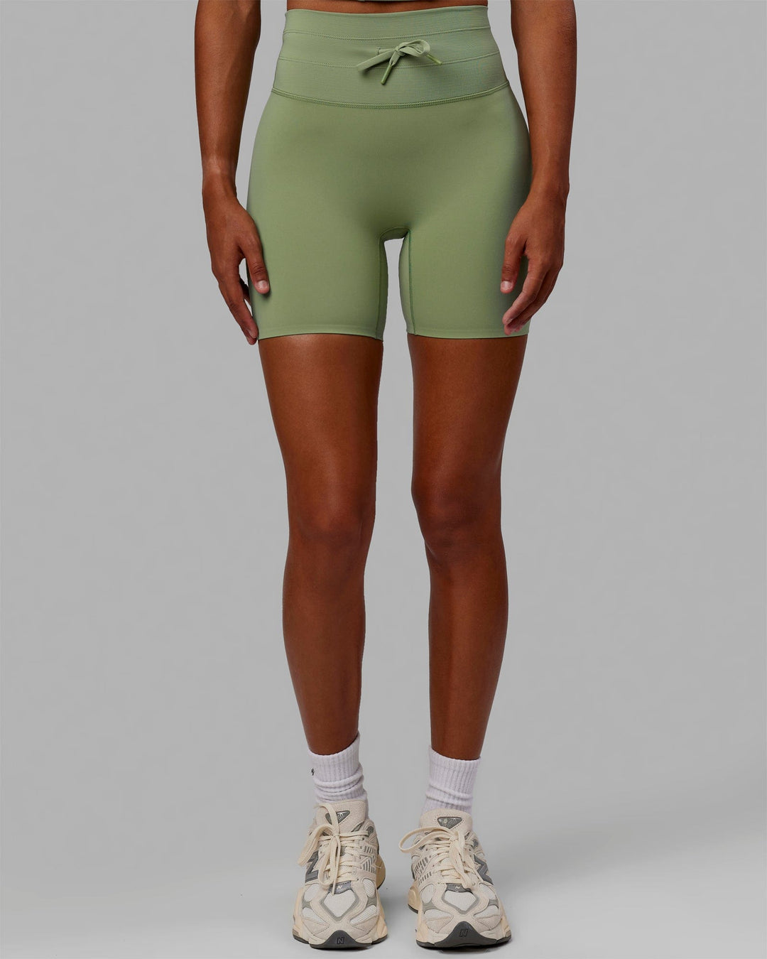 Woman wearing Resistance Mid Short Tights - Bayleaf