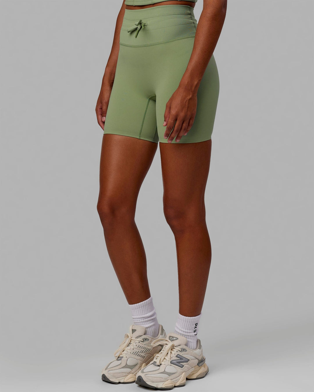 Woman wearing Resistance Ultra High-Rise 6&quot; Short - Bayleaf
