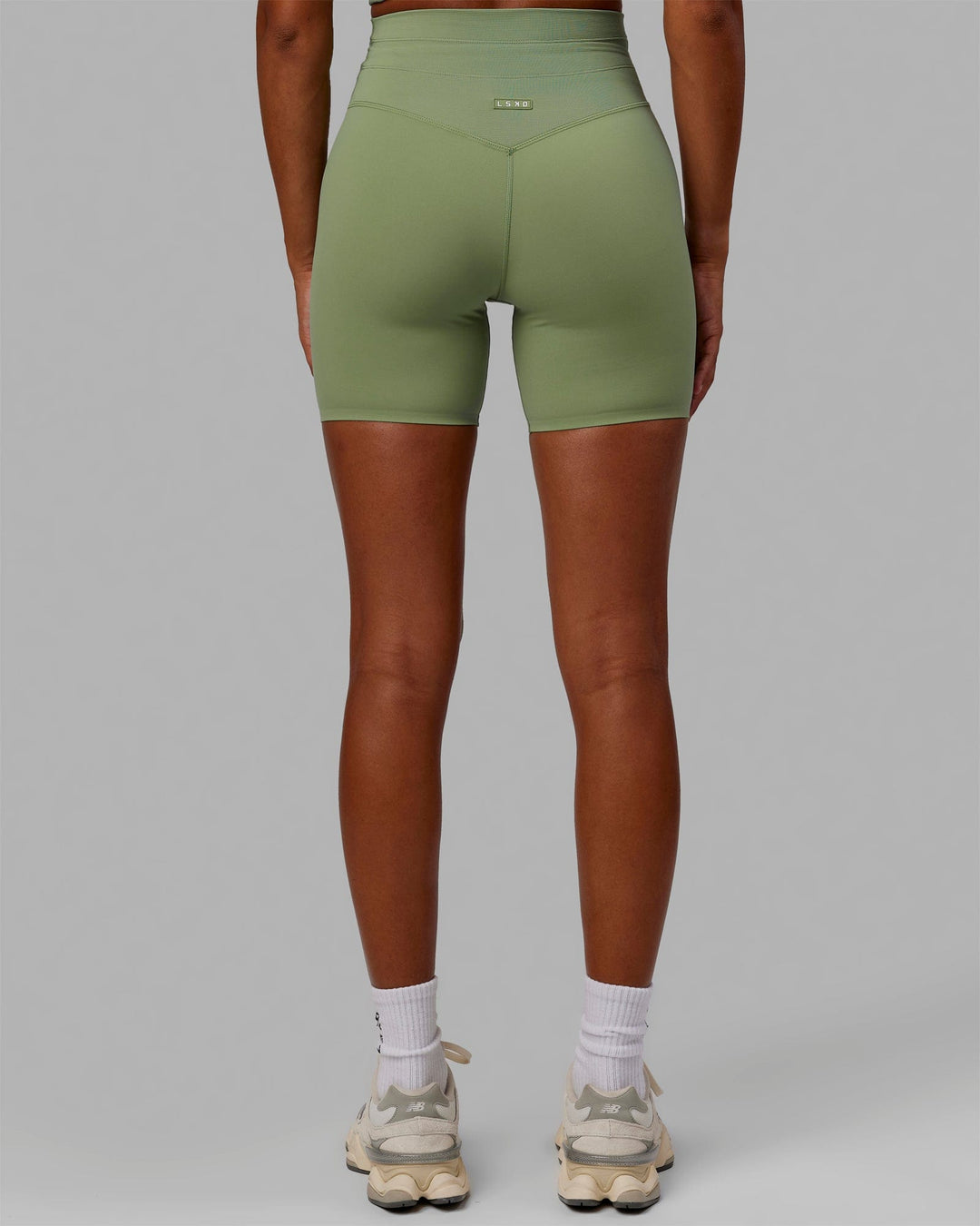 Woman wearing Resistance Ultra High-Rise 6&quot; Short - Bayleaf