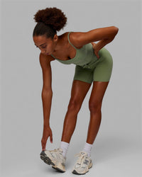 Woman wearing Resistance Ribbed Shelf Bra Performance Tank - Bayleaf