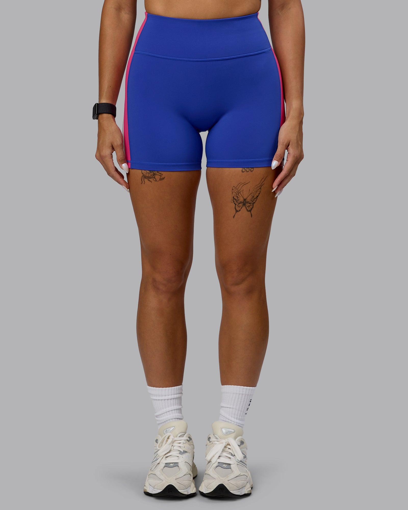 Woman wearing Revitalise Ultra High-Rise 4" Short - Power Cobalt-Fuchsia Pink