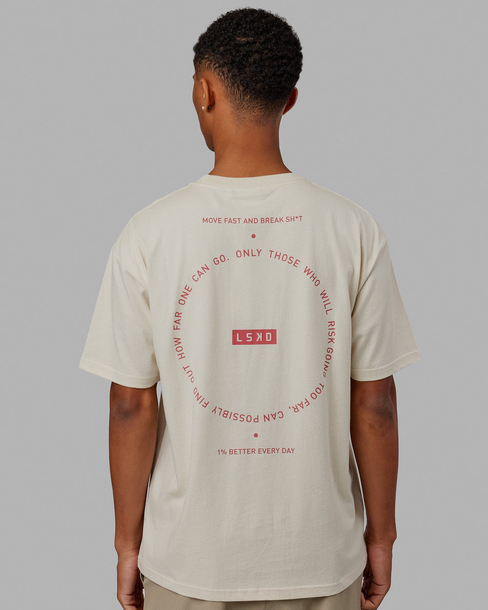 Man wearing Unisex Rotate Tee Oversize - Bone-Mineral Red