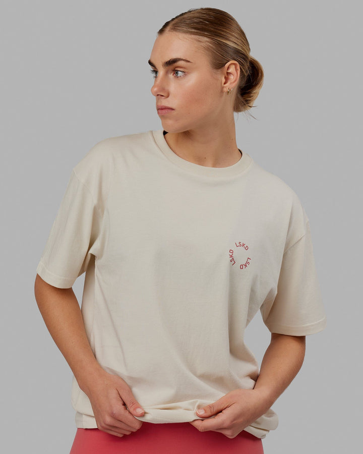 Woman wearing Unisex Rotate Tee Oversize - Bone-Mineral Red