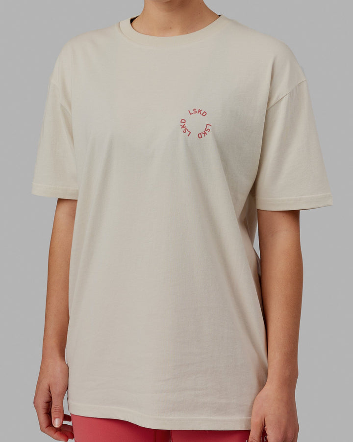 Woman wearing Unisex Rotate Tee Oversize - Bone-Mineral Red