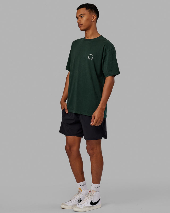 Man wearing Unisex Rotate Tee Oversize - Vital Green-White