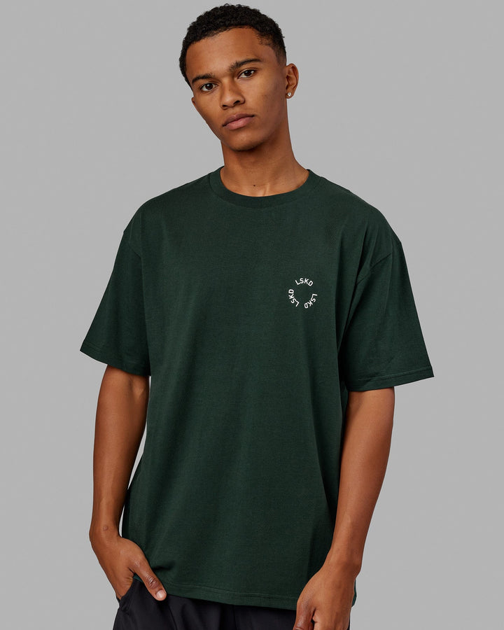 Man wearing Unisex Rotate Tee Oversize - Vital Green-White