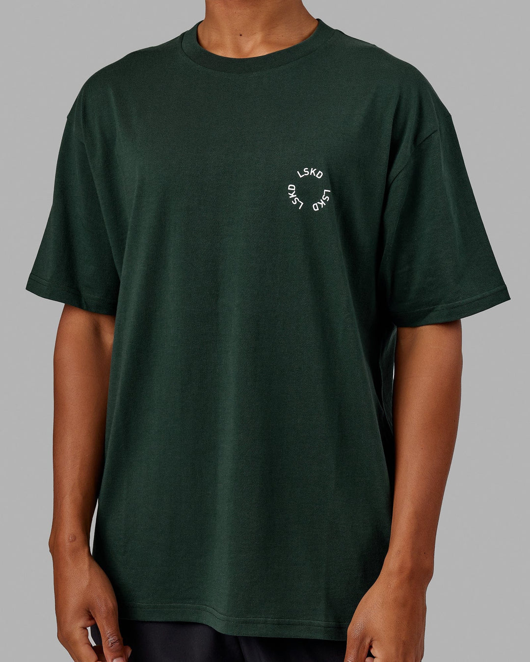 Man wearing Unisex Rotate Tee Oversize - Vital Green-White