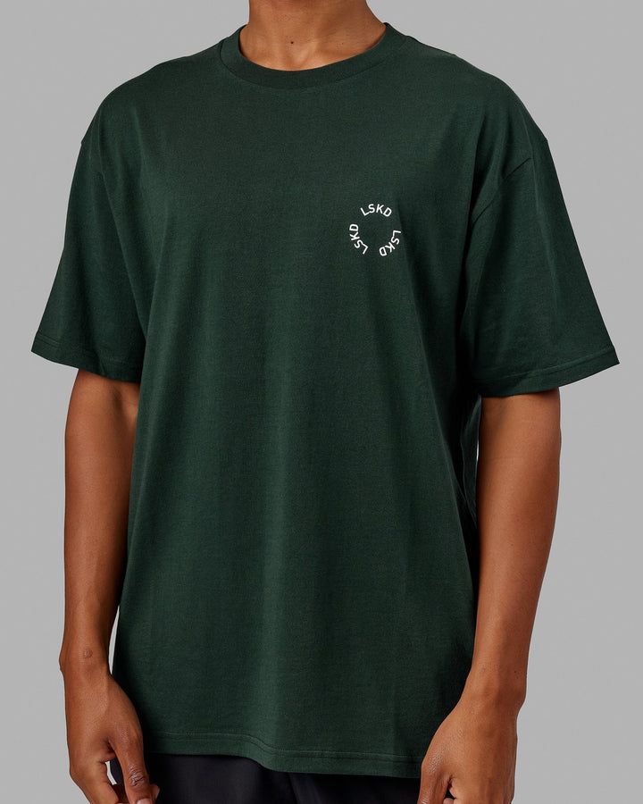 Man wearing Unisex Rotate Tee Oversize - Vital Green-White