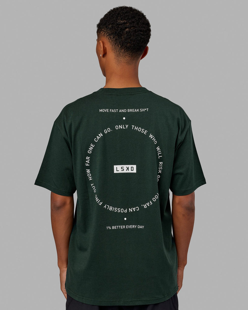 Man wearing Unisex Rotate Tee Oversize - Vital Green-White