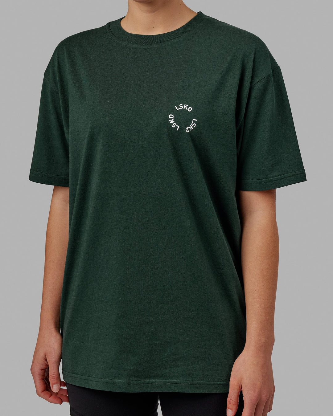 Woman wearing Unisex Rotate Tee Oversize - Vital Green-White