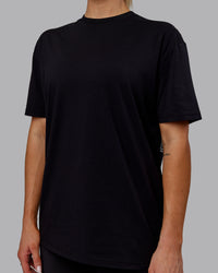 Woman wearing Sara GET ÆTLA SKAL Unisex FLXCotton Tee Oversize - Black-White