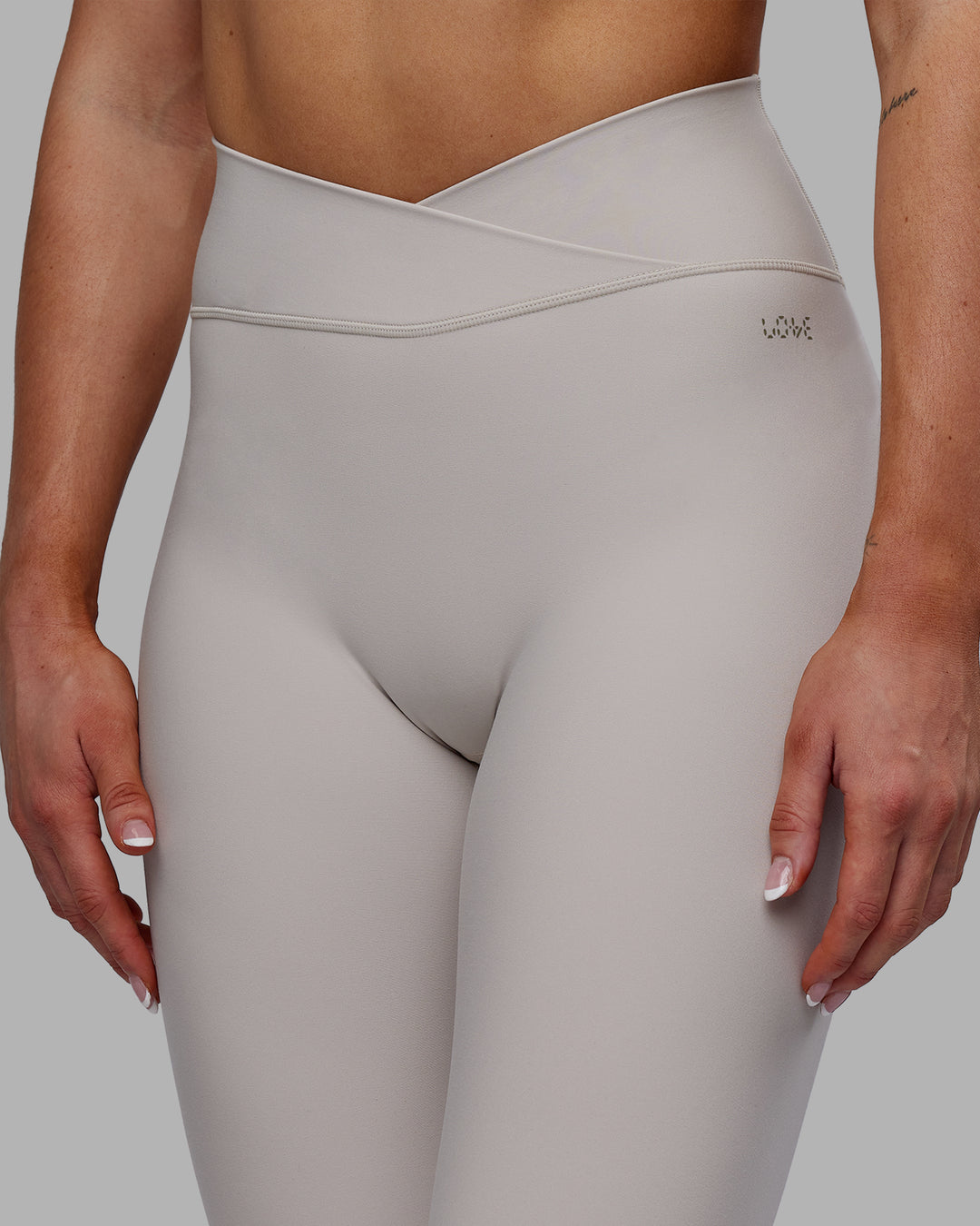 Woman wearing Sara Strike Ultra High-Rise Cross Over Waist Full Length Legging - Shale Beige