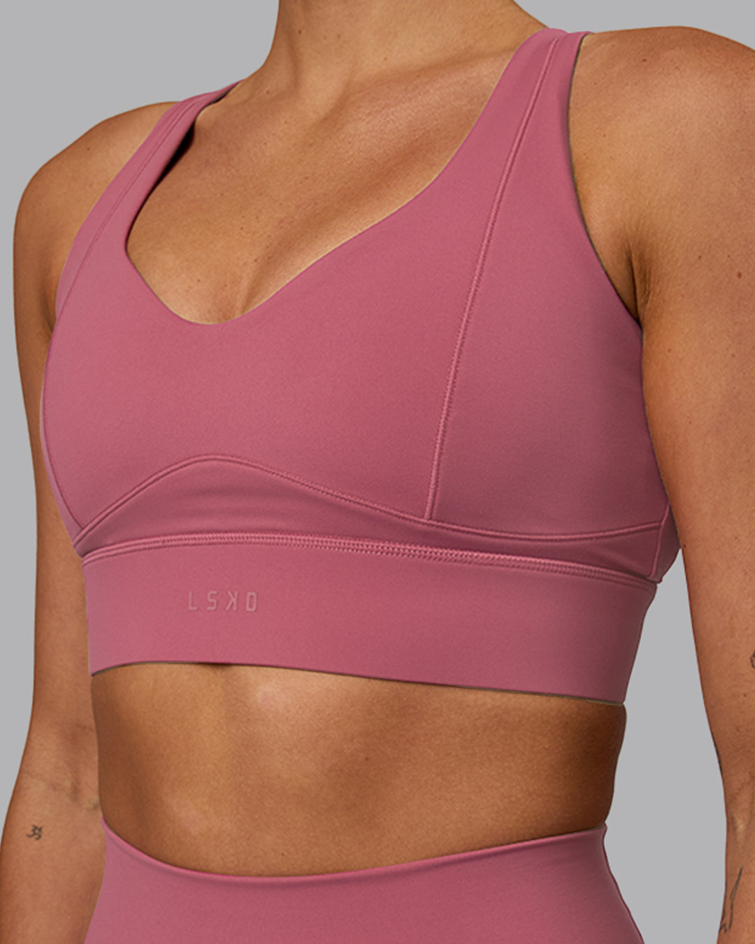 Woman wearing Sculpt Sports Bra - Mauve Haze