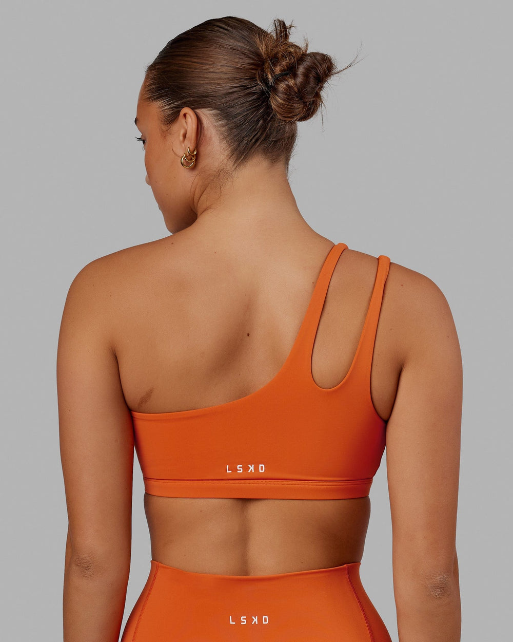 Woman wearing Set Up Sports Bra - Burnt Orange
