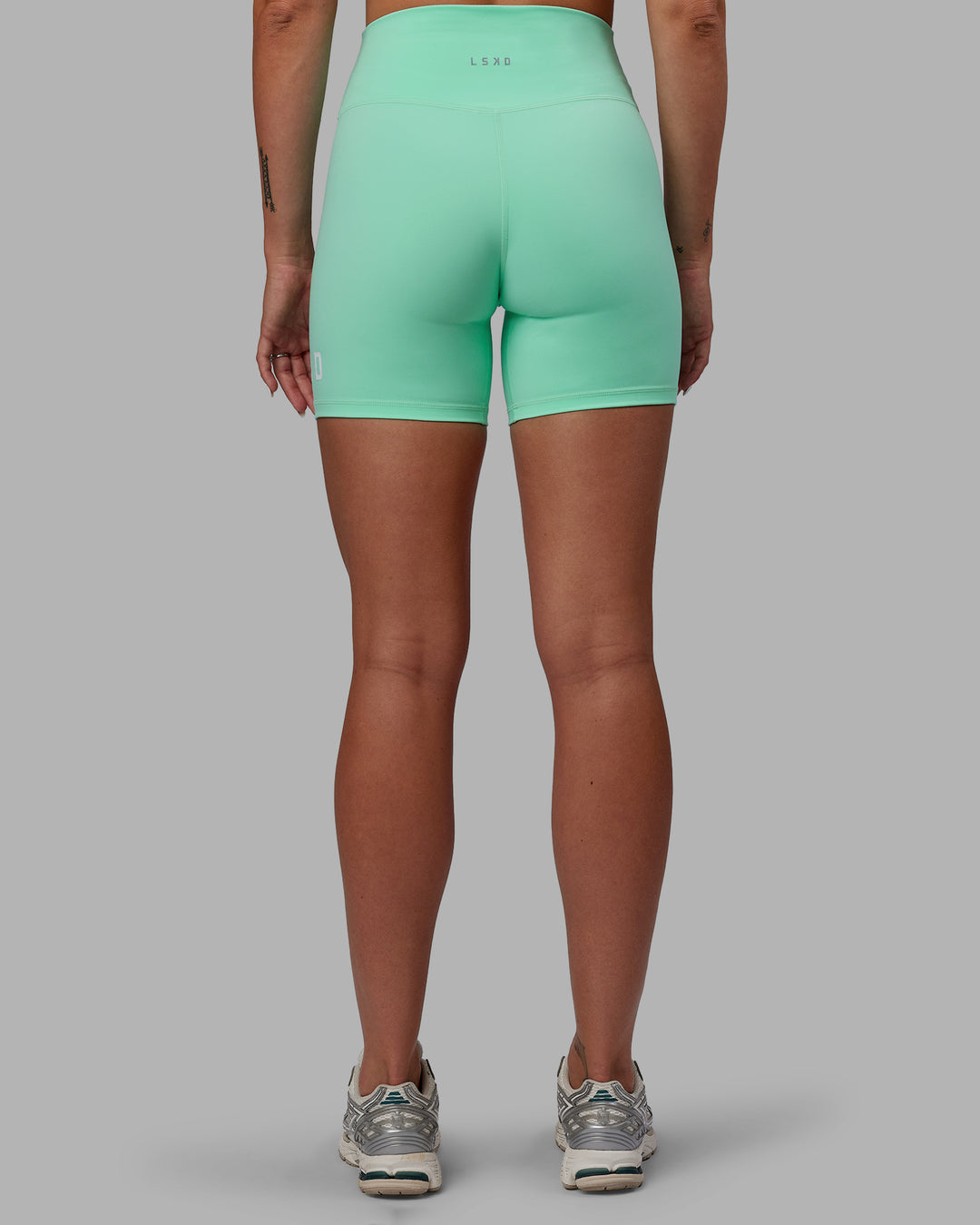 Woman wearing Shayna Jack Evolved Ultra High-Rise 6&quot; Short - Ice Green-White
