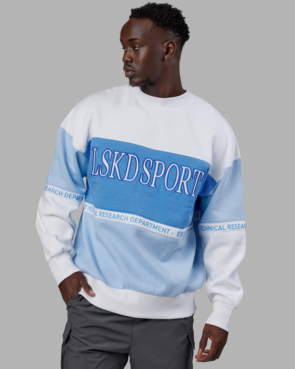 Man wearing Unisex Sportif Sweater Oversize - Windsurfer-Azure Blue